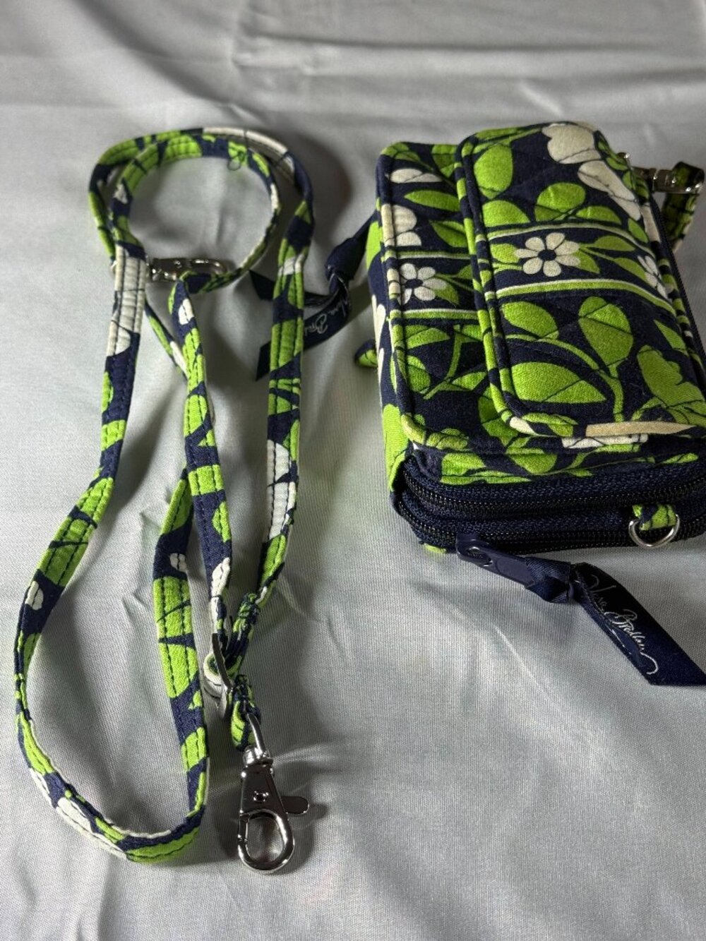 Vera Bradley Green Leaves and White Flowers Wristlet Wallet.